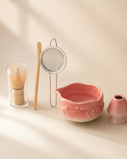 Blush Bow Sakura Pink matcha set: bowl, whisk, whisk holder, scoop, and sifter flat lay