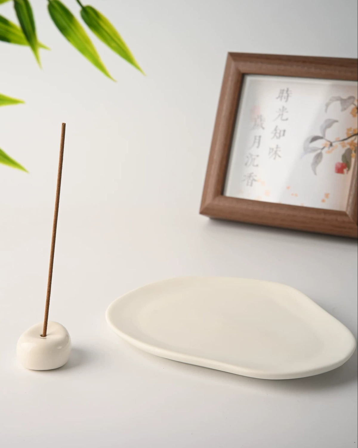 The stone holder beside the empty ceramic tray, showing that the set is two separate pieces