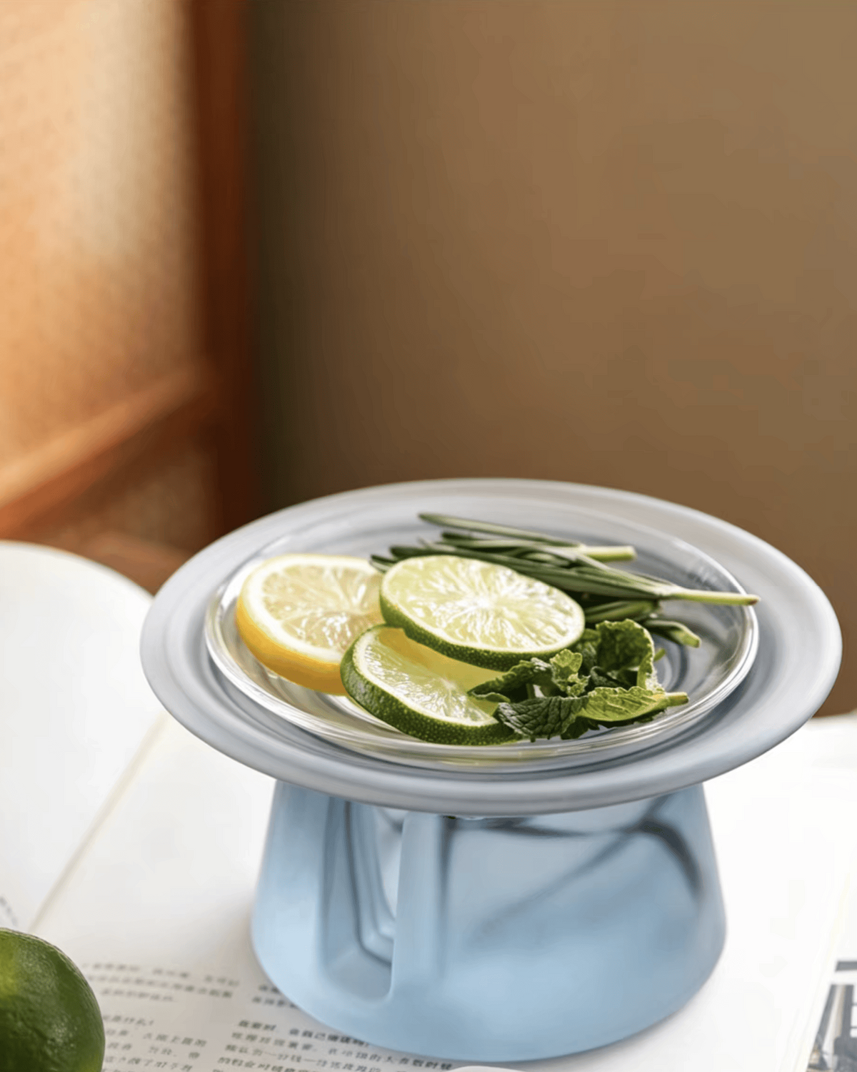 Ink wash blue-grey liuli glass incense warmer with lemon, lime and rosemary in the upper dish