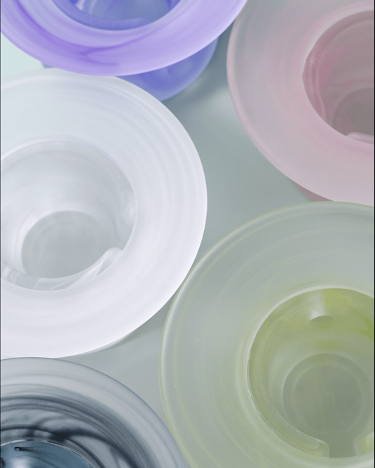 All five colours of the liuli glass incense warmer grouped together: twilight purple, blossom pink, bone white, celadon green and ink wash